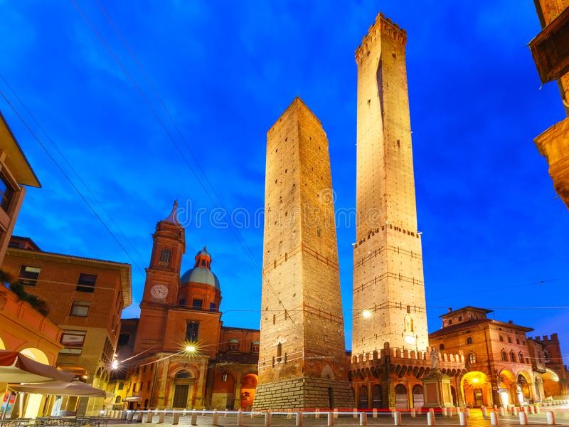 famous-two-towers-bologna-night-italy-asinelli-garisenda-both-them-leaning-symbol-statue-san-petronius-church-saints-103966110-1685283493.jpg